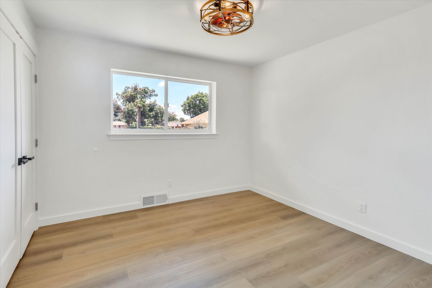 Second bedroom with window to the side yard